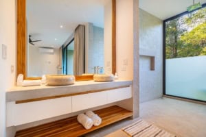 Contemporary bathroom with ocean view and natural light in Dominical.