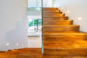 Contemporary wooden staircase inside a luxury tropical home in Dominical.
