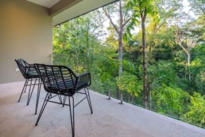Balcony overlooking lush tropical forest in Dominical, Costa Rica.