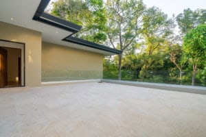 Spacious terrace with forest view in Dominical luxury home.