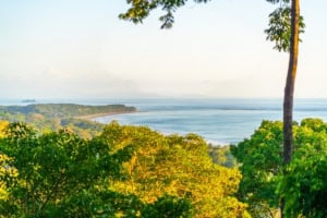 Scenic view of the ocean and lush tropical forest in Dominical, Costa Rica.