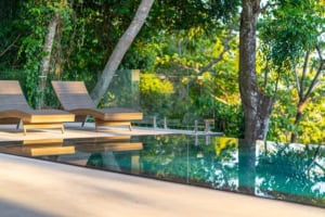 Infinity pool overlooking lush tropical forest in Dominical, Costa Rica.