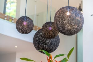 Contemporary spherical pendant lights hanging in a stylish living space.