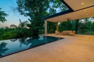 Modern tropical home with infinity pool and lush greenery in Dominical.