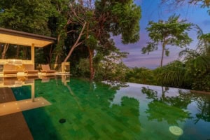 Ocean view tropical home with infinity pool and lush greenery in Dominical.