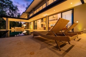 Modern tropical home with pool, outdoor lounge, and ocean view in Dominical.