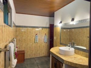 Bathroom in Dominical Costa Rica real estate property with sink and towels.