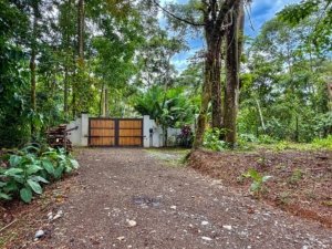 Gated entrance to a lush tropical estate in Dominical, Costa Rica.