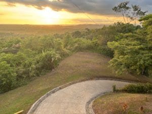 Beautiful sunset over lush green landscape in Dominical, Costa Rica.