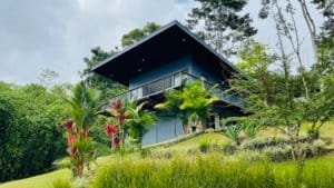 Contemporary house on hillside surrounded by lush tropical forest in Dominical.