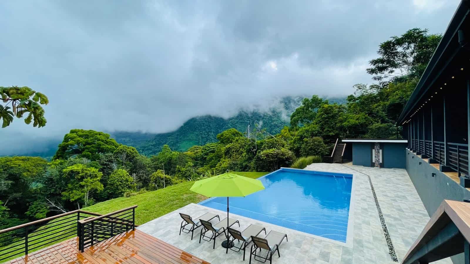 Luxury pool with mountain and rainforest view in Dominical, Costa Rica.