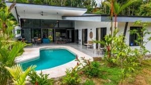 Contemporary house with pool and lush tropical garden in Dominical, Costa Rica.