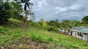Build-ready hillside lot with lush greenery and scenic views in Uvita.