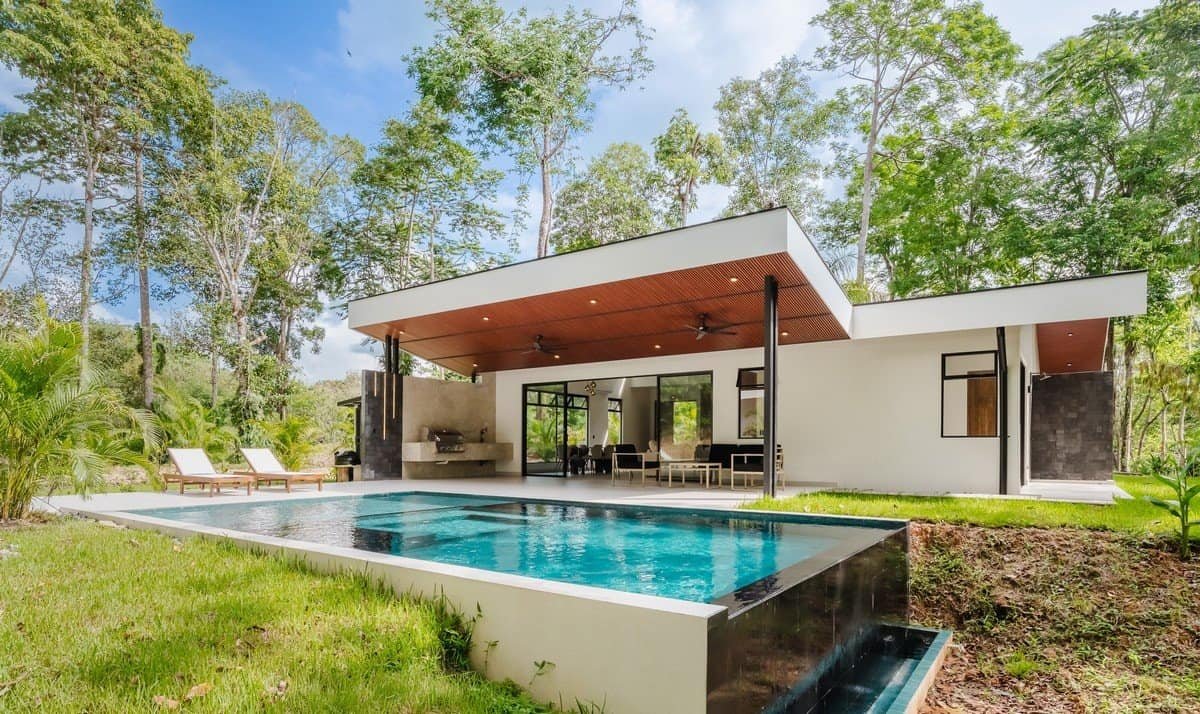 Modern private home in Dominical with infinity pool and lush surroundings.