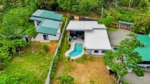 Aerial view of a resort-style home near Dominical with pool and lush greenery.