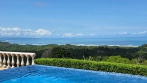 Scenic view of the ocean and lush greenery from a tropical estate in Dominical.
