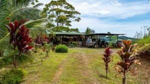 Scenic view of mountain home with guest cabin and parking near Nauyaca Waterfalls.