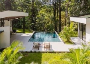 Modern Costa Rican home with infinity pool and lush jungle surroundings.