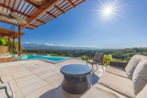 Outdoor terrace with infinity pool and mountain view in Dominical.