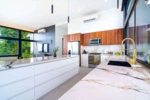 Contemporary kitchen with panoramic ocean view and stylish design.