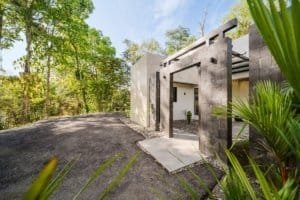 Modern private home with sleek design and lush greenery in Dominical.
