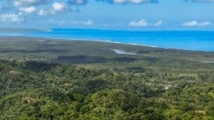 Panoramic view of the ocean and lush landscape in Dominical, Costa Rica.