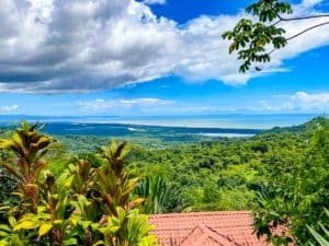 Stunning ocean view from lush tropical landscape in Dominical, Costa Rica.
