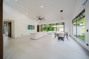 Spacious living room with large windows and minimalist decor in Costa Rica.