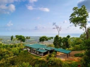 Modern luxury home with panoramic ocean views and lush greenery in Dominical.