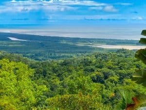 Stunning ocean view from lush green mountain landscape in Dominical.