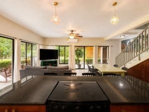 Bright living room with large windows and modern decor in Dominical.