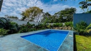 Beautiful private pool surrounded by lush tropical garden in Dominical.