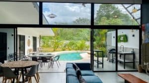 Contemporary home with pool, outdoor dining, and lush garden in Dominical.