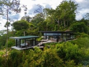 Modern luxury home with panoramic ocean views and lush greenery in Dominical.