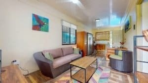 Cozy living room with sofa, chairs, and colorful decor in Dominical.