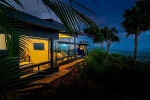 Modern Costa Rica home with panoramic ocean views and lush surroundings.