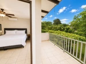 Balcony view of lush greenery from a Dominical villa in Costa Rica.