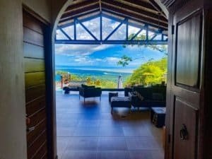Stunning ocean view from a cozy living room with outdoor seating in Dominical.