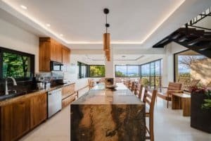 Modern kitchen with ocean and jungle view in Dominical estate.
