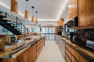 Spacious kitchen with wooden cabinets, granite countertops, and modern appliances.