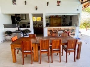 Elegant dining room with wooden table and ocean view in Dominical.