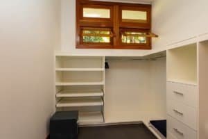 Spacious walk-in closet with shelves and drawers in mountain home.