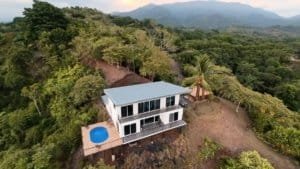 Modern home with pool and panoramic mountain and ocean views in Dominical.