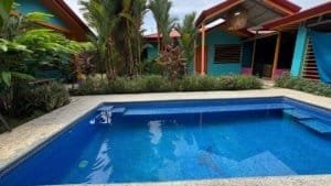 Beautiful pool with tropical garden and villas in Dominical, Costa Rica.