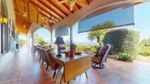 Covered porch with seating and ocean view in Dominical, Costa Rica.