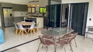 Spacious kitchen and dining space with modern appliances and seating.
