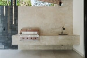 Contemporary outdoor kitchen with grill and sink in Dominical, Costa Rica.