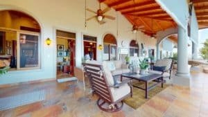Spacious covered patio with seating and white water view in Dominical.