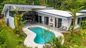 Contemporary home with pool, surrounded by lush greenery in Dominical.