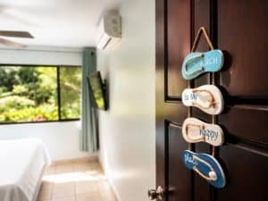 Decorative wooden sign with beach, happy, and place in Dominical.